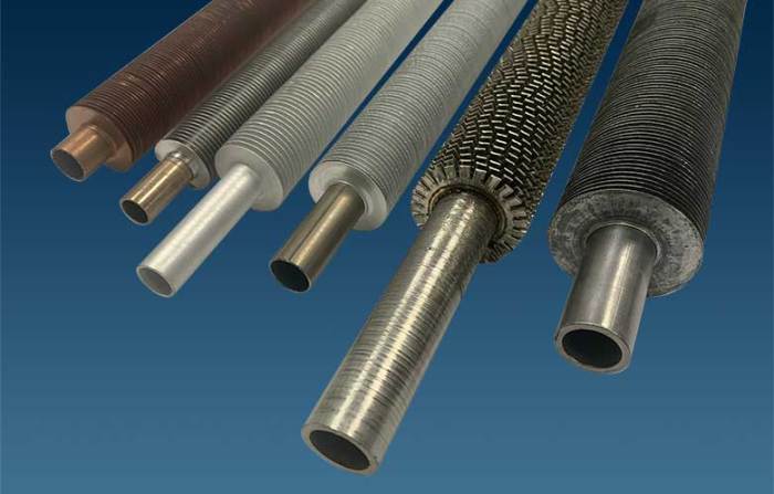 The fins on finned tube coils increase heat transfer by